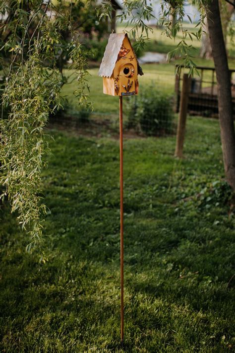 birdhouse mounted on a pole